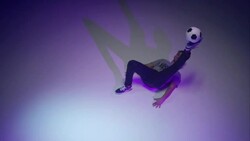 young male soccer freestyler juggling a ball on his brines Stock Footage