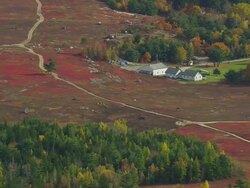 WS ARIEAL View of Houses on field / Maine, United States Stock Footage