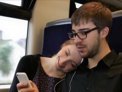 Young couple on earphones and streaming video. Stock Footage