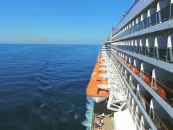 WS Side POV View of Cruise ship Queen Mary 2 of Cunard Line with small boat / North Sea, Jutland, Denmark Stock Footage