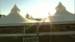A sunburst beams behind the canopy of a pavilion in Saudi Arabia. Stock Footage