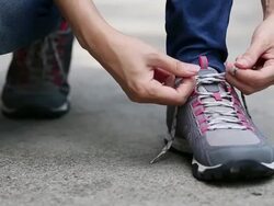 female tying shoelace Stock Footage