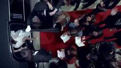 Celebrity couple step out of limousine, sign autographs for fans, and walk up red carpet at awards show Stock Footage