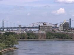 The East River and the Robert F. Kennedy Bridge and the Hells Gate Railroad Bridge Stock Footage