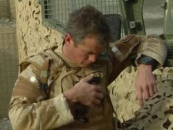 CU Soldier adjusting bag / Afghanistan.  Stock Footage
