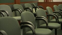 Empty chairs fill a courtroom. Stock Footage