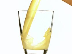 MS SLO MO Orange Juice being poured into glass / Vieux, Normandy, France    Stock Footage