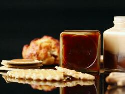 CU PAN Bottle of jam and cookies and bread in black backdrop / Seoul, South Korea Stock Footage