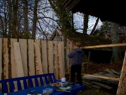 MS T/L Man building  wooden fence / Germany Stock Footage