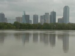 WS View of flooding on Trinity River with trees and downtown Dallas during Tropical Storm Hermine / Dallas, Texas, United States Stock Footage