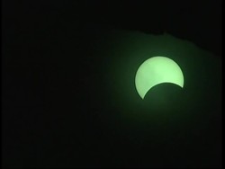 Crowds watch partial solar eclipse over Coliseum News Clip