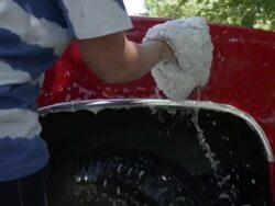 View of person washing jeep. Stock Footage