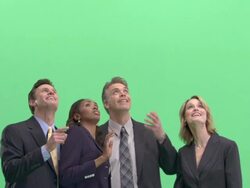 CU, Four businesspeople looking up in studio Stock Footage