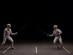 Two men fencing, man on left makes contact with his epee Stock Footage