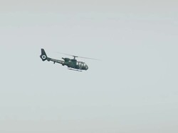 WS AERIAL TS Shot of Gazelle Military Helicopter flying in sky / Rhone Alpes, France Stock Footage