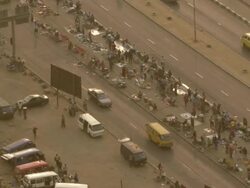 WS AERIAL View of road and bridge with pedestrian and yellow cabs / Lagos, Nigeria Stock Footage