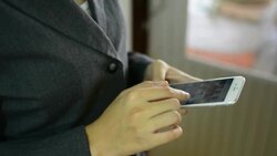 Businesswoman using a smartphone. Stock Footage