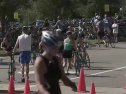 WS Triathletes with bicycles at transition area / Chicago, Illinois, USA Stock Footage