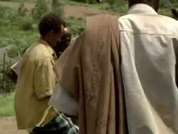 Men finishing a camel deal at camel fair Stock Footage