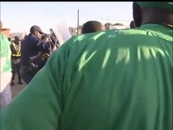 Thousands of soccer fans stampeded outside a stadium Sunday before an exhibition game between Nigeria and North Korea, leaving 15 people injured, including one police officer who was seriously hurt. News Clip