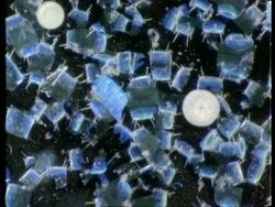 Many blue rectangle shaped crystals against black rotating Stock Footage