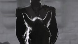 A horseman holds the horse of a uniformed officer in French Revolution era clothing. Stock Footage