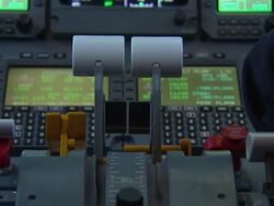 Pilots in cockpit landing executive jet at sunset News Clip