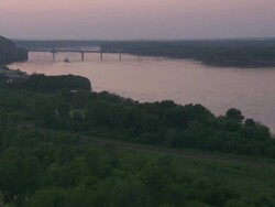 WS Boat moving in Hannibal Mississippi river at sunset / Hannibal, Missouri, United States Stock Footage