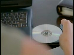 CU hand taking CD out of disc drive Stock Footage