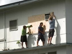 Boarding Up Window Prior to Hurricane Stock Footage