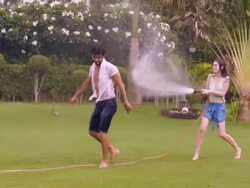 Young couple romancing in the park, Delhi, India Stock Footage