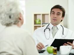 Doctor giving green apple to patient. Stock Footage