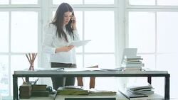 Young entrepreneur working in her office. Stock Footage
