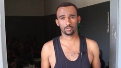 Migrants, officials comment at detention centre News Clip