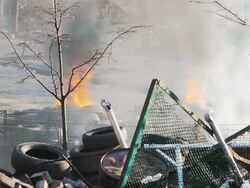 Burning tyres near barricade - Protests 2014 Stock Footage