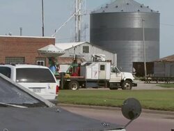 Pull out from shot of DOW doppler on wheels radar truck to TIV tornado Intercept vehicle Stock Footage