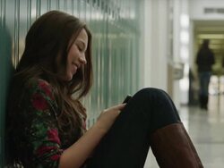 USA, Utah, Alpine, Teenage girl (14-15) sitting at school and using mobile phone Stock Footage