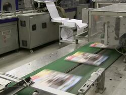 MS Magazines passing on conveyor belt in gravure printing office / Itzehoe, Schleswig-Holstein, Germany  Stock Footage
