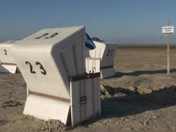 MS Shot of roofed wicker beach chair at beach, North Sea North Frisia, / St. Peter Ording, Schleswig Holstein, Germany Stock Footage