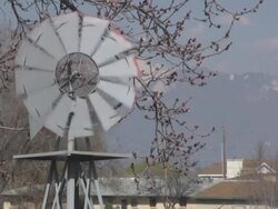 windmill blowing in the wind Stock Footage