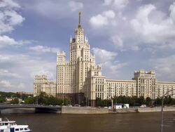 WS T/L View of river with small bridge and high building of Stalin's era against cloudy sky / Moscow, Russia Stock Footage
