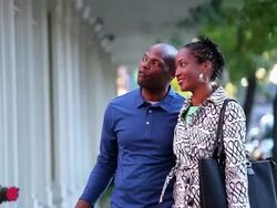 MS TU PAN ZO Adult couple walking down city street for window shopping / Richmond, Virginia, United States Stock Footage