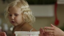 Close up panning shot of mother and daughters rolling cookie dough / Orem, Utah, United States Stock Footage