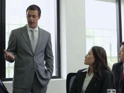 MS Business men and woman listening to business man talking in conference room / China Stock Footage