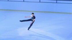 SLO MO TS Male figure skater jumping Stock Footage