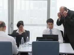 HD DOLLY: Supervisor Assisting Office Team Stock Footage