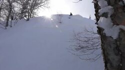Skier skiing in fresh powder on a mountain. Stock Footage