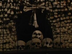 Pull back skull Bone church Kutna hora Czech Republic Stock Footage