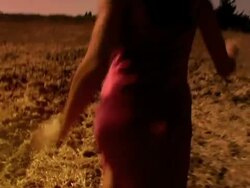 Young woman running in a field Stock Footage