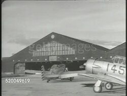 1949: NATIONALIST PARTY: VS Chinese Nationalist pulling jet fighter airplane into hangar, various engineers rebuilding damaged aircrafts, lowering damaged fuselage. Taiwan, Formosa, Republic of China (ROC), Kuomintang (KMT) Instructional Video